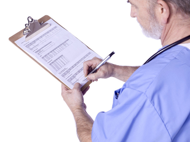 Egy férfi orvos orvosi vágólap írás - Fotó, kép