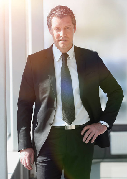 portrait of confident businessman on blurred background - Fotó, kép