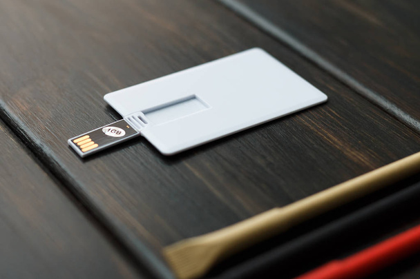 Workspace with envelope, wallet, business usb flash card card, pen.  - 写真・画像