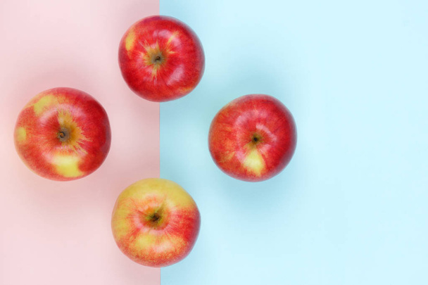 Apple, fruit pop art, red apple on a pink blue background, fruit for breakfast, vitamins, vegetarian food, pastel background, minimalism, designer blank, Asian food, American breakfast - Fotoğraf, Görsel