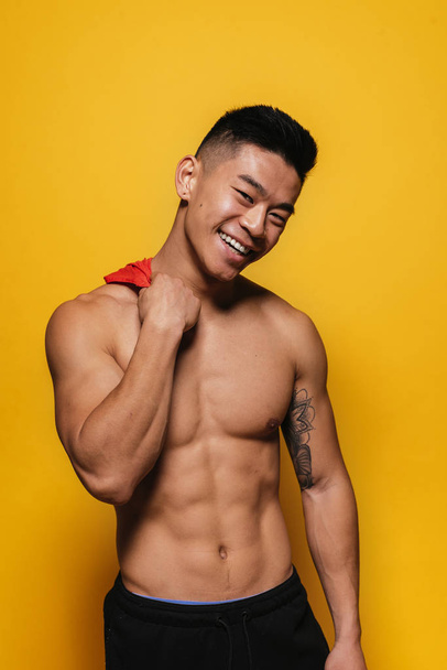 Portrait of young asian boy with fitness body. - Фото, изображение