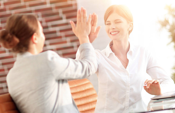 members of the business team giving each other a high five. - Foto, Imagem