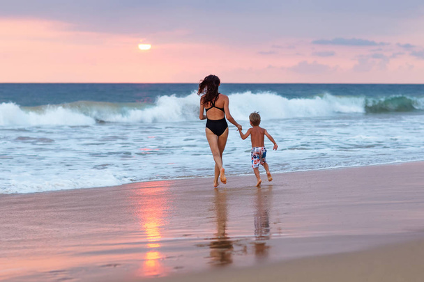 A family is having fun at the seashore - Фото, зображення