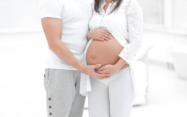Happy pregnant couple in a new house in a new housing - Foto, immagini