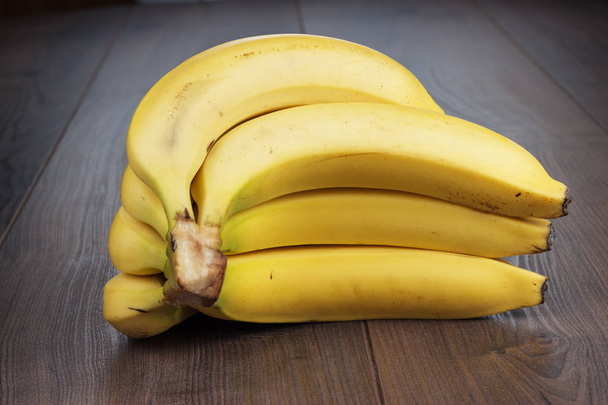 fresh bananas on the brown table - Valokuva, kuva