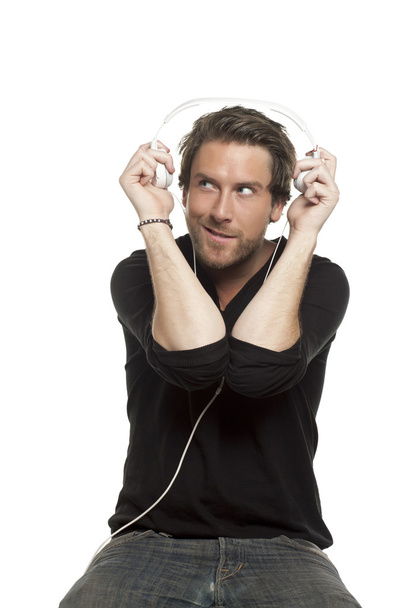 a man listening to the music wearing headphone - Foto, imagen