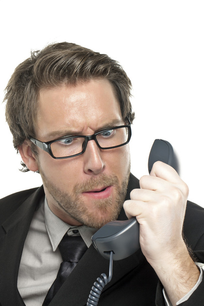 hombre de negocios enojado mirando al teléfono
 - Foto, Imagen