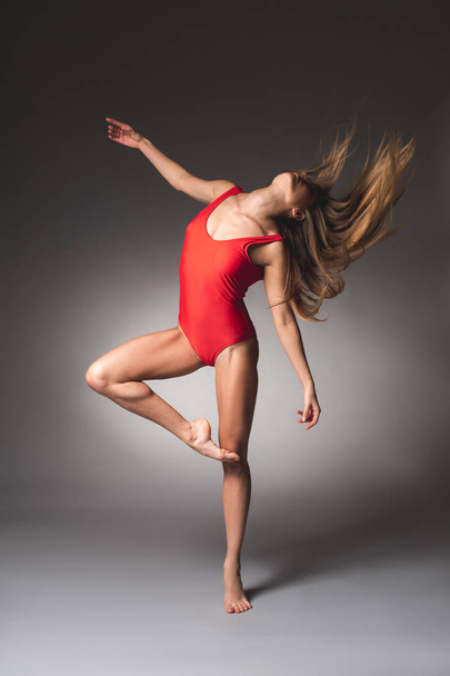 Thin lady making choreographic movements - Photo, Image
