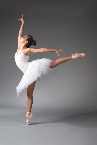Lightweight ballerina floating in the air - Фото, изображение