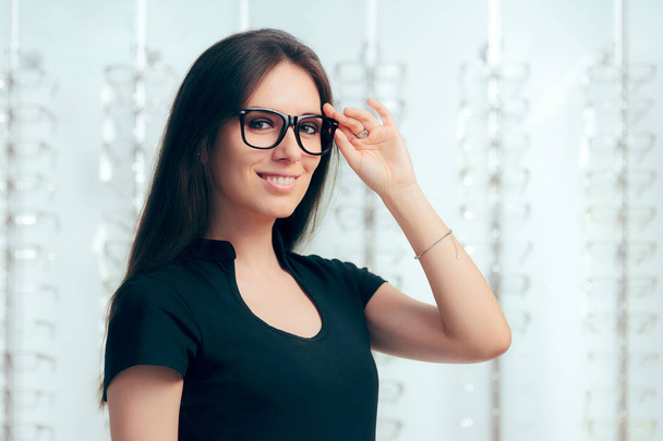 Woman Wearing Eyeglasses in Optical Store  - Фото, зображення