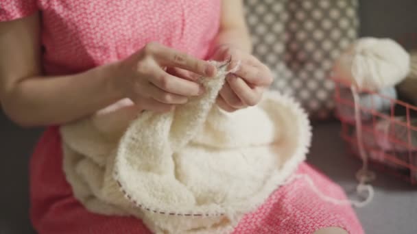 Craft woman knitting wool clothes from woolen yarn. Woman knitting hands - Footage, Video