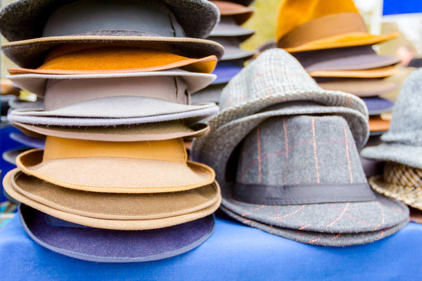 Lined male hats in the flea market - Photo, Image