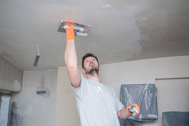 Worker Plastering Ceiling - Photo, Image