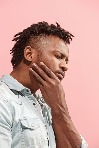 Young Afro-American man is having toothache. - Photo, Image
