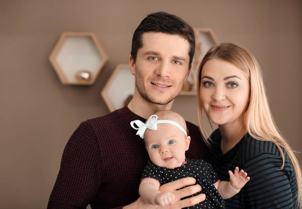 Young parents with baby at home - Foto, Bild
