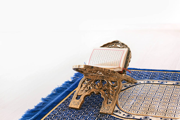 Open holy book of Muslims on stand - 写真・画像