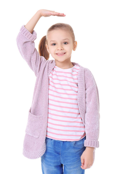 Little girl measuring height on white background - Foto, Imagem