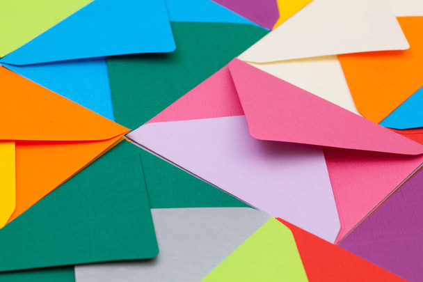 Different colored envelopes on the desk - Fotó, kép