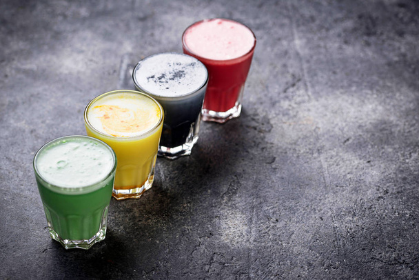 Super lattes with charcoal, beetroots, matcha and turmeric - Fotoğraf, Görsel