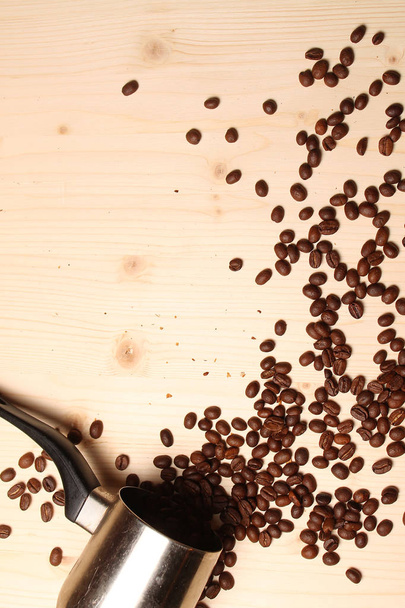 Coffee beans scattered on the table - Photo, image