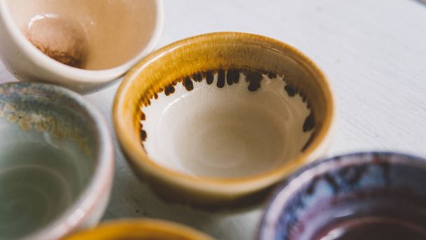 ceramic bowls for drinks close-up.  Ceramic ware made by own hands - 写真・画像