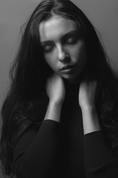 black and white portrait of young woman with closed eyes   - Valokuva, kuva