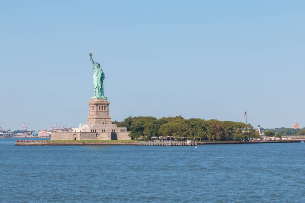 Statue of Liberty and panoramic view of Manhattan City skyline. - Photo, image