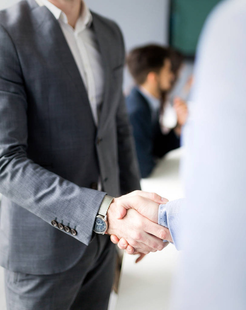 Business people shaking hands in modern conference office - Fotó, kép