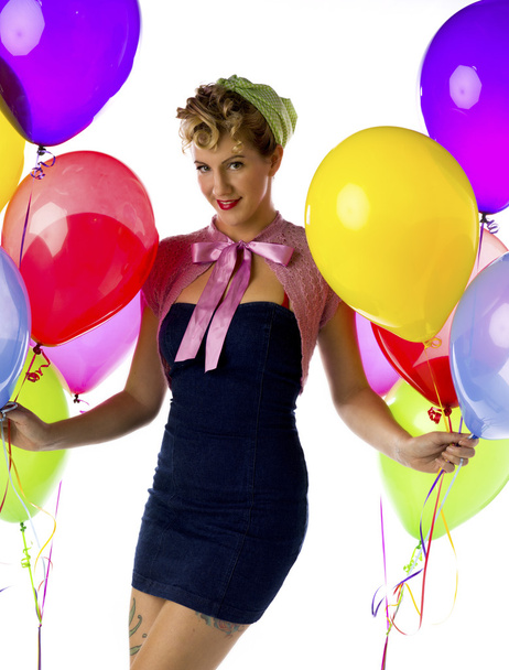 woman holding onto balloons - Photo, image