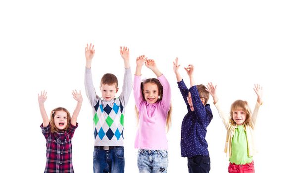 Children with raised hands - 写真・画像