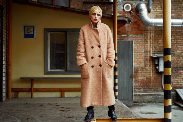 Young beautiful woman in fashionable coat posing  - Photo, image