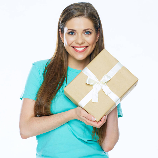 Happy woman holding paper gift box with white ribbon  - Fotó, kép