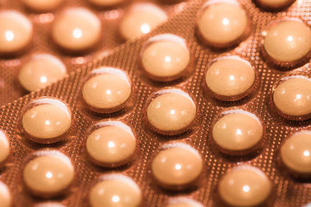 Háttér, makró sárga gyógyszert tabletta - Fotó, kép
