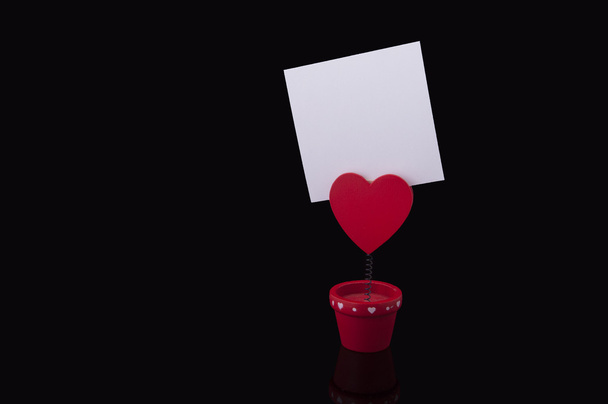 Red holder with heart and paper - Foto, Imagem