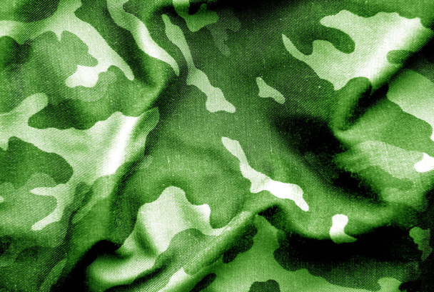 Military uniform pattern with blur effect in green tone. - Photo, Image