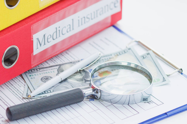 Clean insurance form, pen, magnifying glass and money - Photo, Image