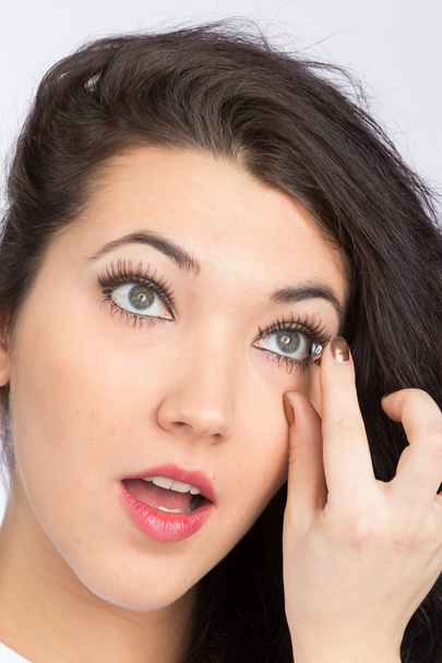 Young woman with contact lense - Foto, imagen