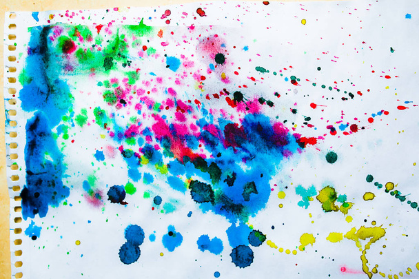 close-up of colored watercolor splashes on white paper background - Foto, immagini