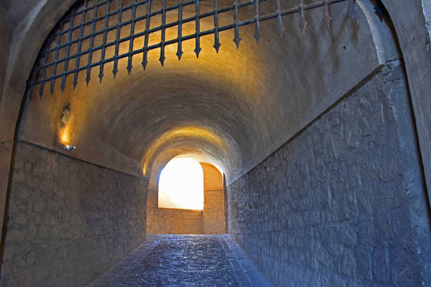 Italy, Naples, 12 / October / 2017, Castel Sant'Elmo. Medieval castle, year 1329, partly made from the living rock  yellow tuff); it is the highest point of the city. Interior corridor and grating. - Photo, Image