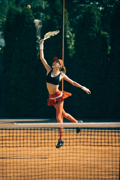 Tennis woman player with racket on lawn - Foto, Imagen