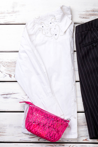 Pink lace purse on white blouse. - Foto, Bild