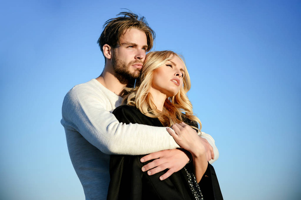 Muscular man and woman with long blond hair, love. - Fotó, kép