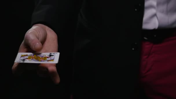 magic, card tricks, gambling, casino, poker concept - man showing trick with playing cards - Filmati, video