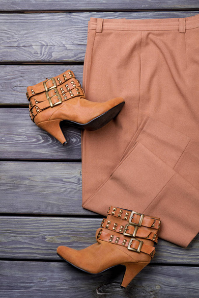 Brown womens heel suede shoes and trousers. - Photo, Image