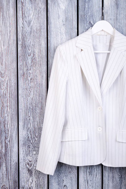 White suit jacket on hanger. - Photo, Image