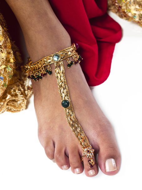 close up shot of a woman wearing gold anklet - Photo, Image