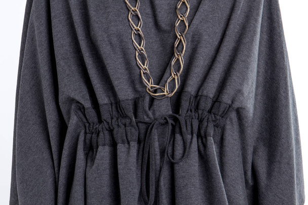 Close up black cotton womens clothes with chain necklace. - Photo, Image