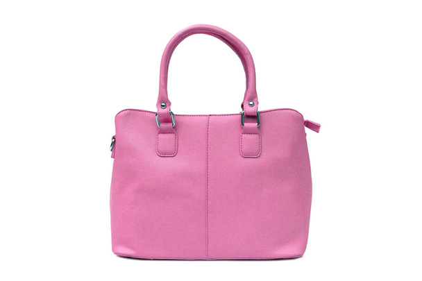 白で隔離ピンクの女性のハンドバッグ                              - 写真・画像