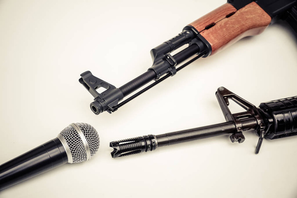 Microphone vs. Rifle / Freedom of the press is at risk concept / World press freedom day concept - Photo, Image