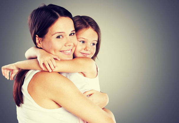 Mother and daughter hugging   - Foto, afbeelding